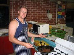 Brenton cooking a spicy shrimp filling for coconut rice rolls